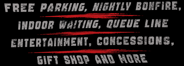 Amenity features list graphic. Text reads: FREE PARKING, NIGHTLY BONFIRE, INDOOR WAITING, QUEUE LINE ENTERTAINMENT, CONCESSIONS, GIFT SHOP AND MORE. Distressed stone textured text separated by red brush strokes on a black background.